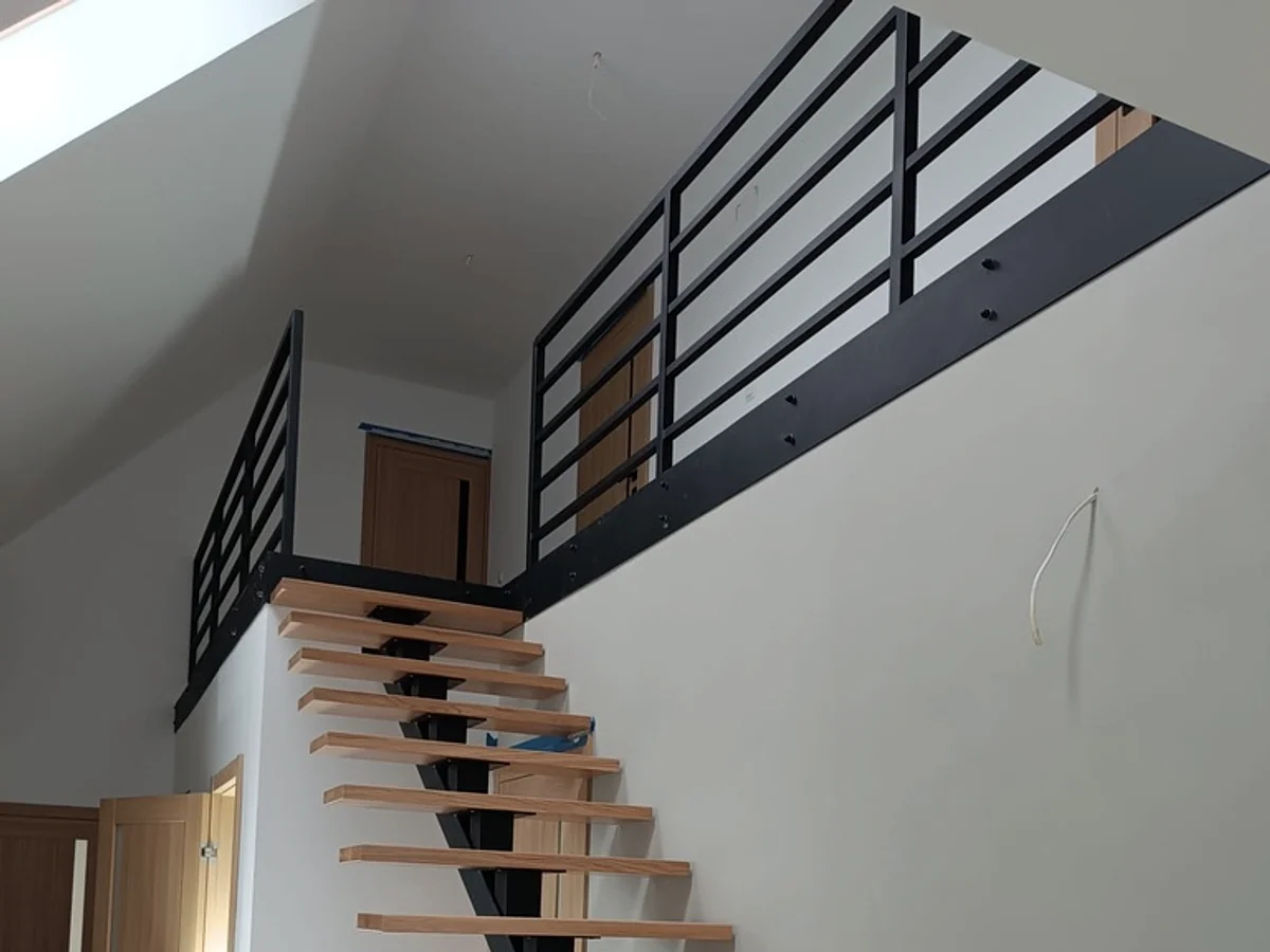 Mezzanine and railing rhythm from below.